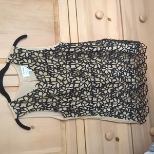 Black lace knit tank top over nude tank top